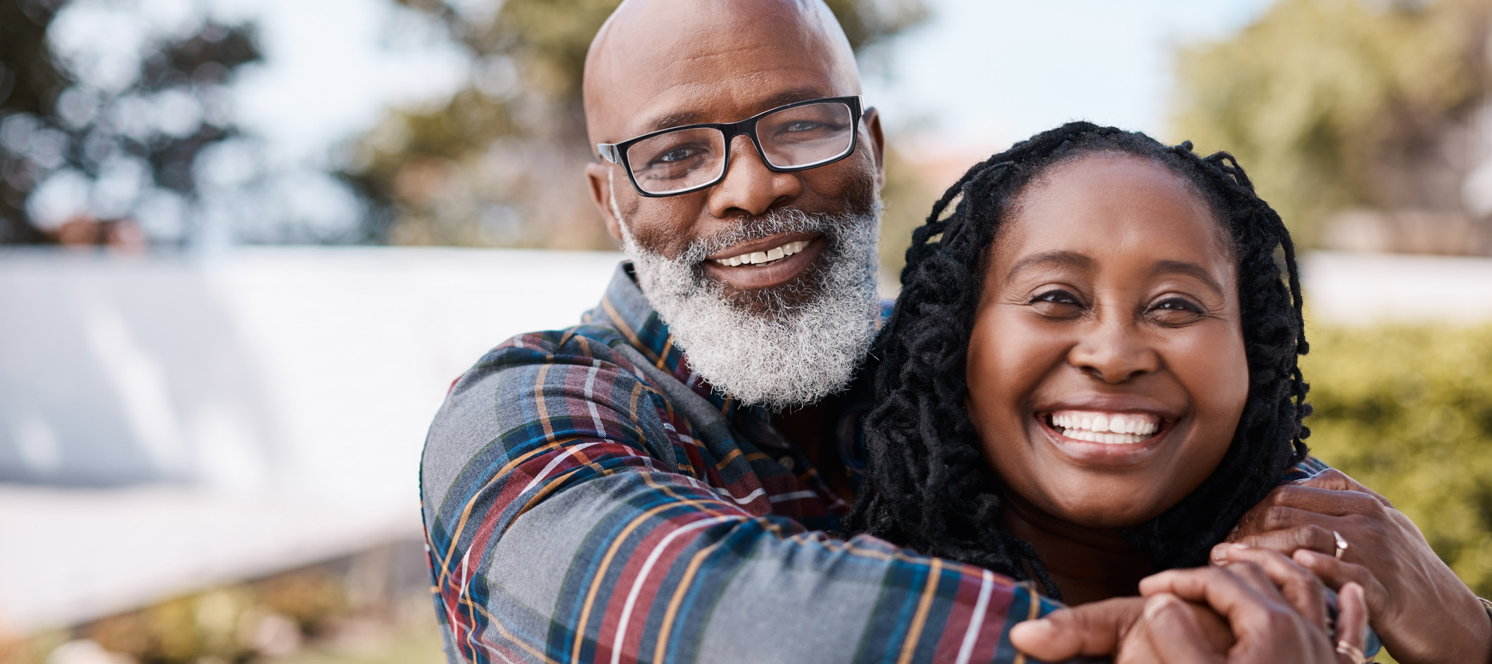 Picture of an older man hugging a smiling woman